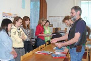 Director František Janák is giving diplomas to the students